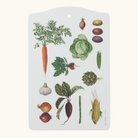 Hvidt skærebræt med botaniske illustrationer af gulerød, løg, kål, majs og andre grøntsager