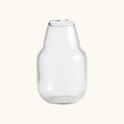 Luro vase i klart riflet glas med bred rund krop og smal hals