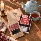 Adventskalender med brun kuvert mærket 1. søndag i advent, tepose med Flødekakao og novelhæfte af Selma Lagerlöf