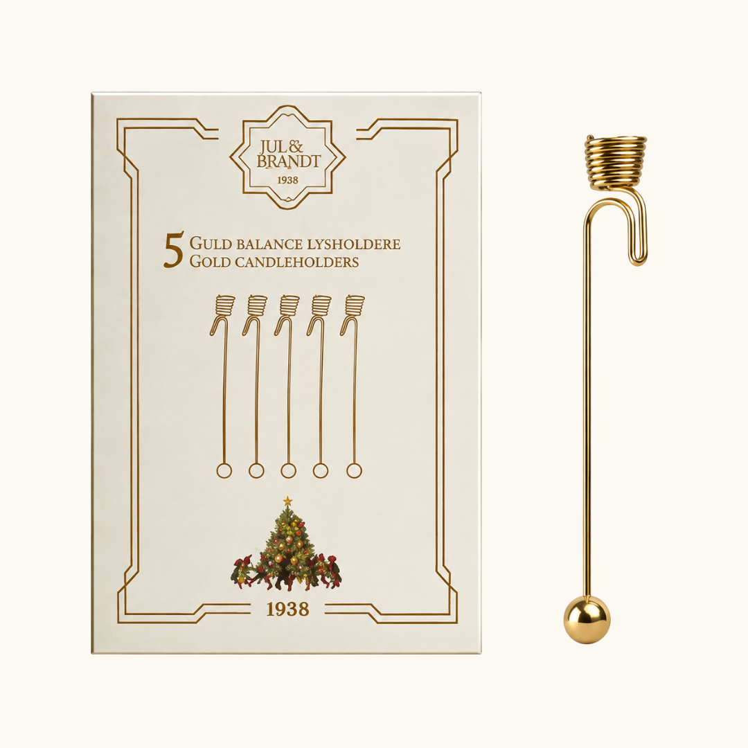 Guldfarvet metal balance lysholder med spiraltopp og kugle i bunden, vist med æske