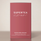 Supertea Seven Herb Organic teæske i rosa med hvid tekst og brailleskrift, 20 tebreve