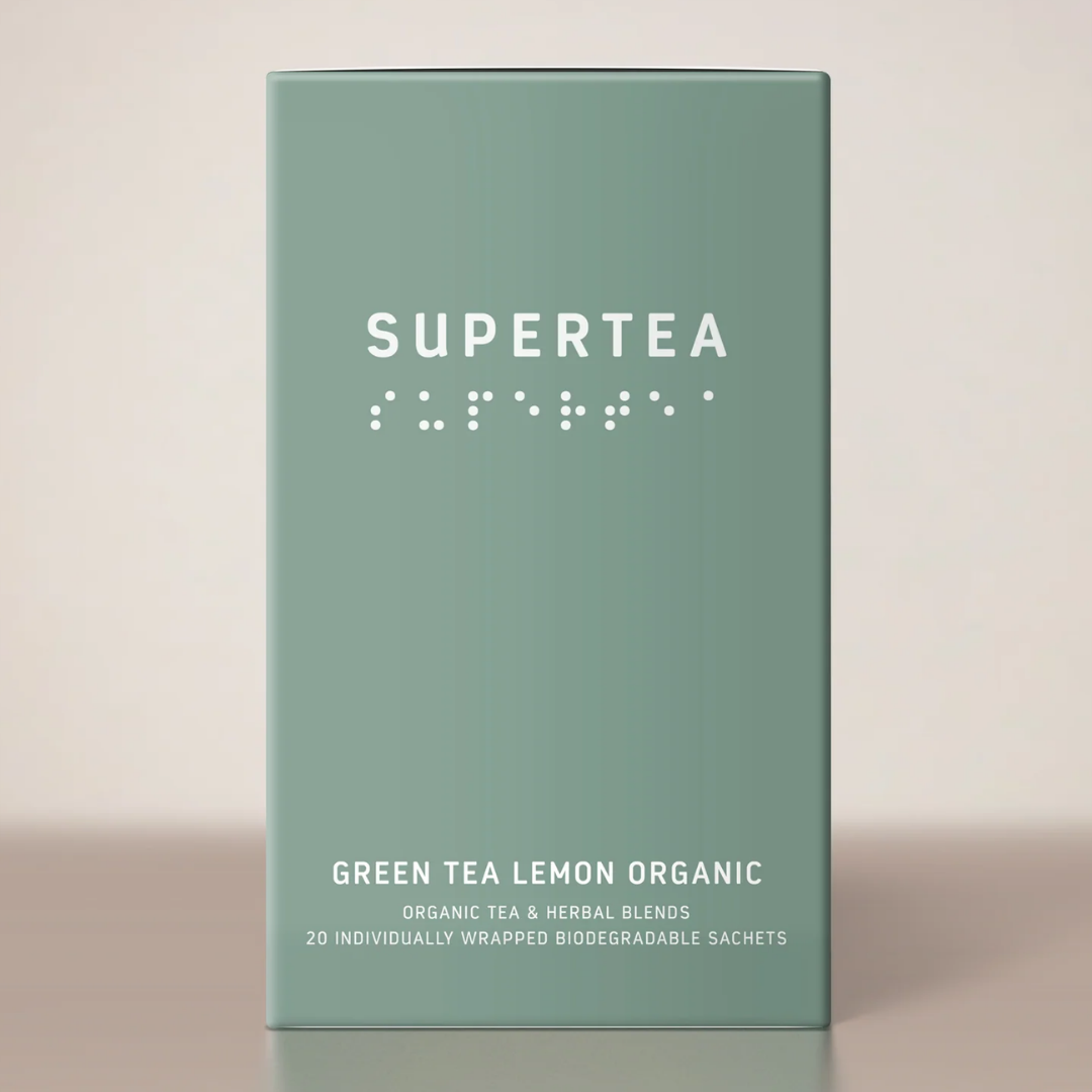 Supertea Green Tea Lemon Organic teæske i støvet grøn med hvid tekst og braille-skrift