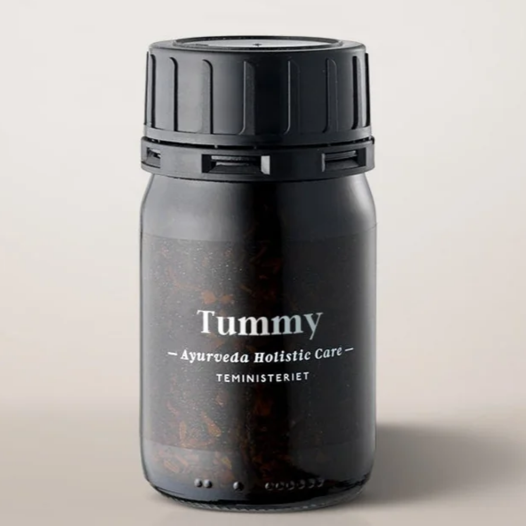 Teministeriet Tummy urtete i sort glaskrukke med sort skruelåg og hvid tekst
