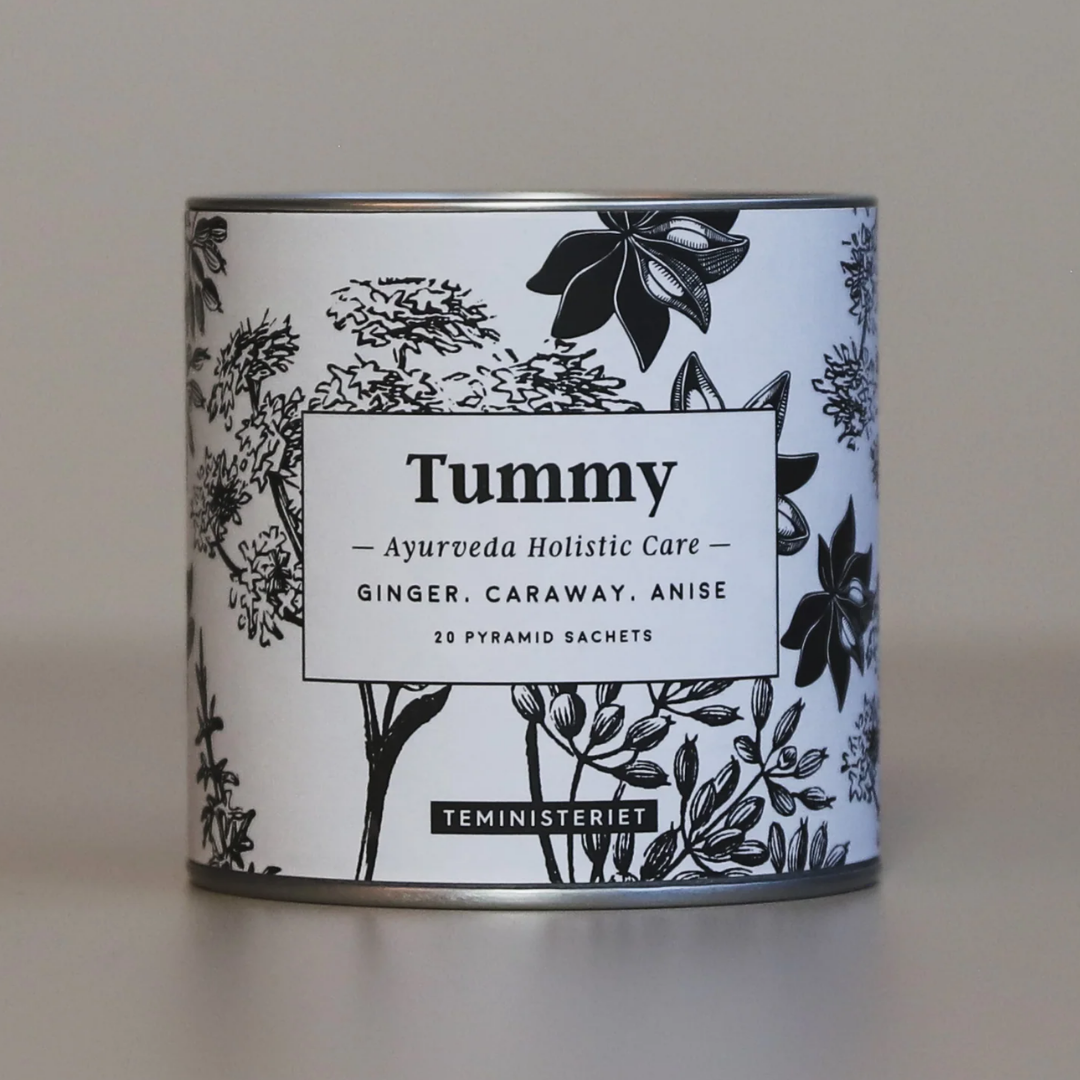 Teministeriet Tummy urtete i rund hvid dåse med sort botanisk illustration